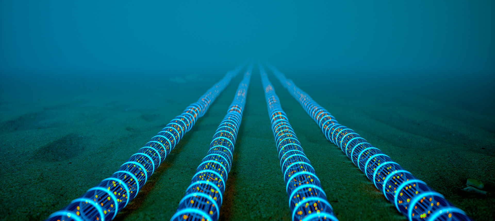Underwater glowing cables on ocean floor